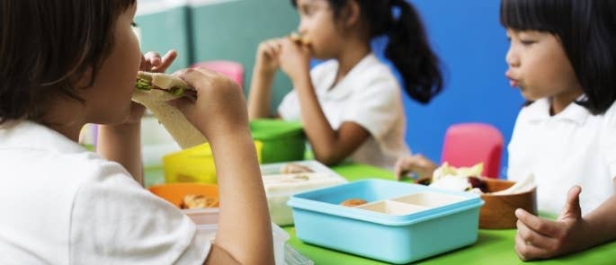 A boy eating lunch at school