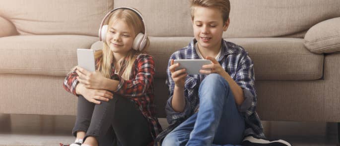 Children playing on smartphones