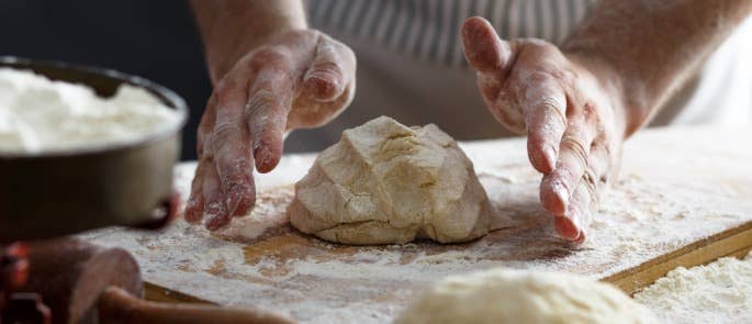 Baker kneading dough