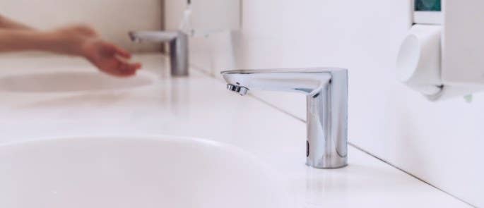 Bathroom tap and soap dispenser