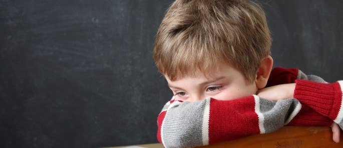 Young boy bored at school