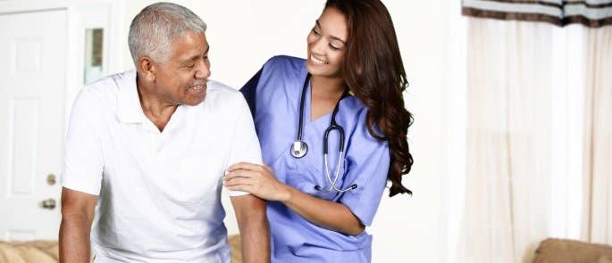 Nurse working with a patient in a care home 