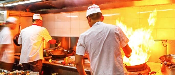 Chefs cooking in a commercial kitchen