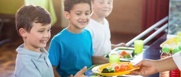 Children getting their school lunch