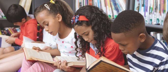 School children reading in the library