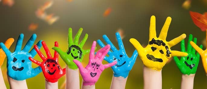 Children with colourfully painted hands