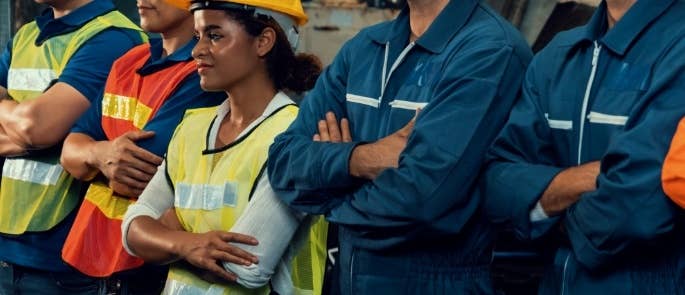 Construction workers having a stand up toolbox talk