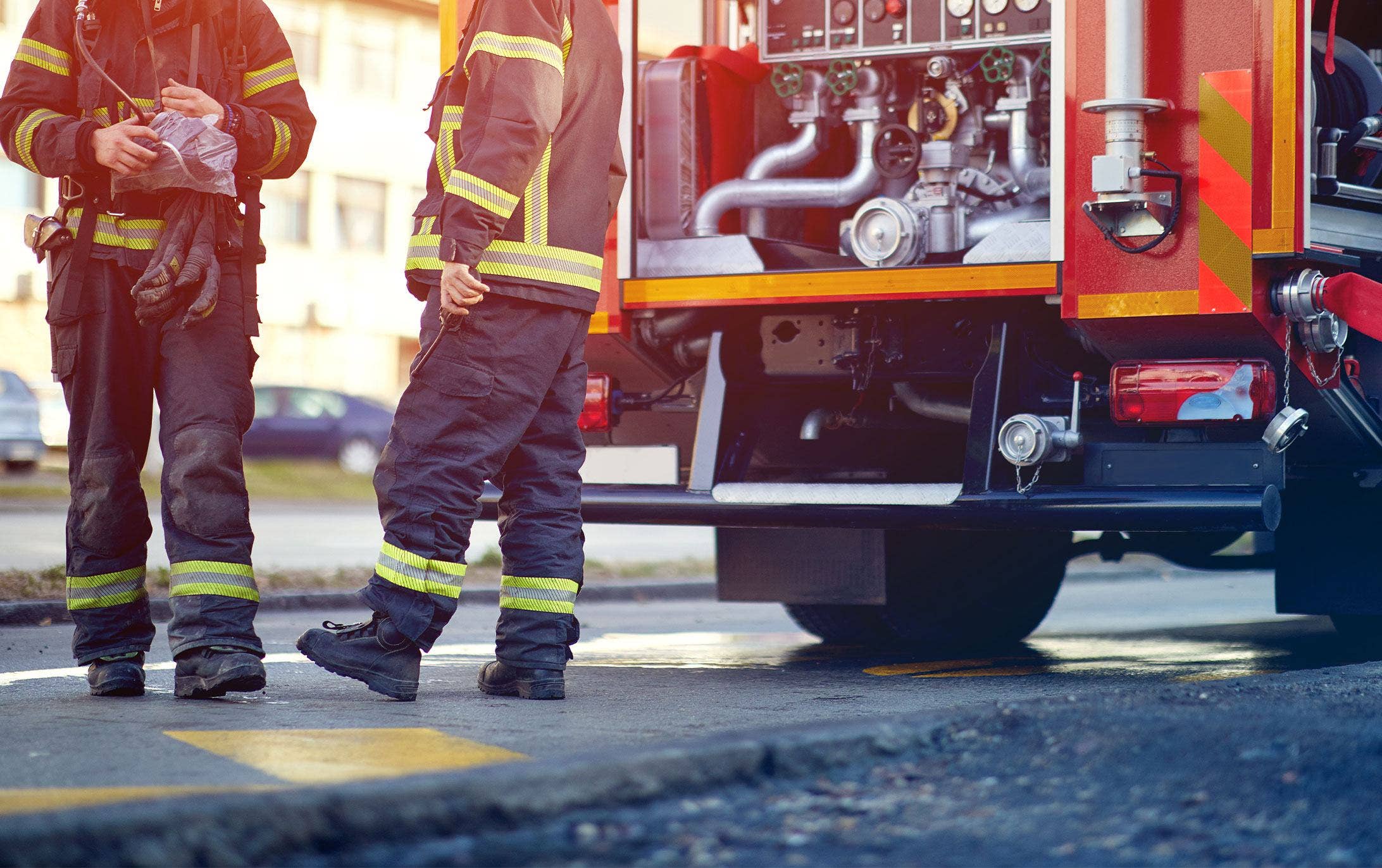 Two firemen walking