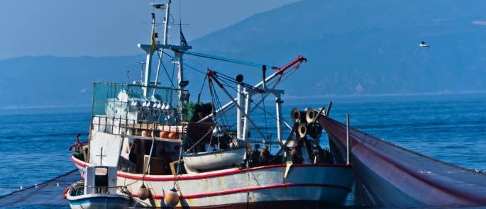 Fishing boat at sea with nets