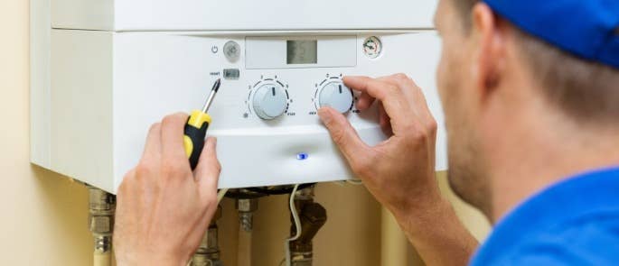 Gas engineer testing a boiler