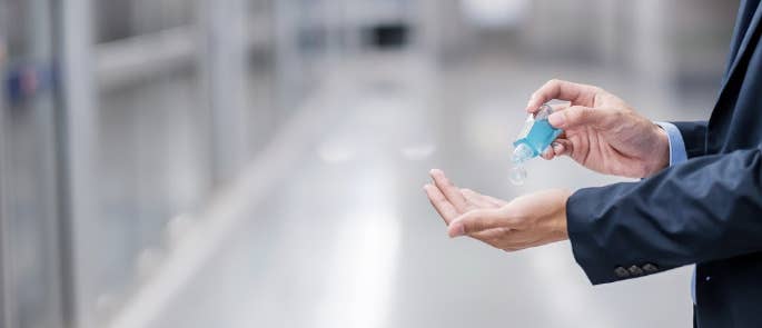 Man using hand sanitiser