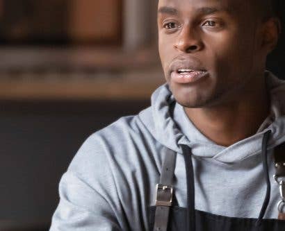 male chef discussing wellbeing with manager