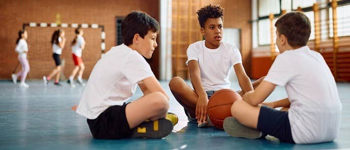 School pupils taking part in a sports lesson