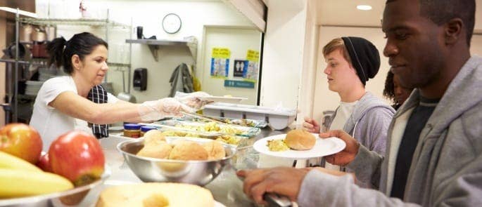 kitchen staff serving food