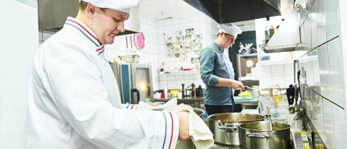 restaurant staff learning new cooking techniques