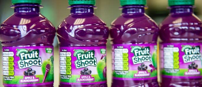 Four individual bottles of Apple & Blackcurrant Fruit Shoot