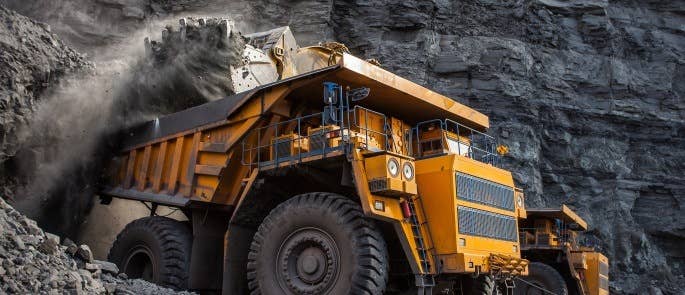 Mining truck loading materials at a mine