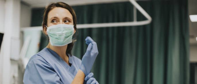 Nurse wearing PPE on a hospital ward