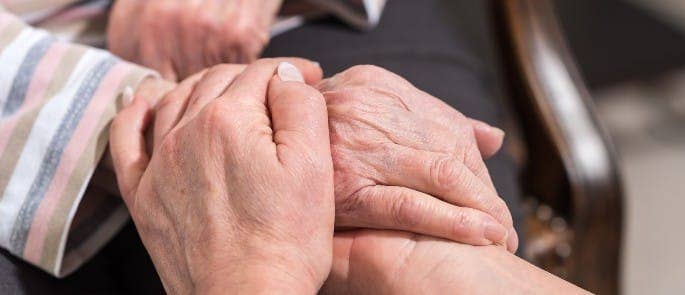 A nurse supporting a patient