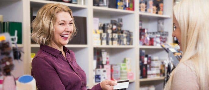 A happy cashier serving a customer