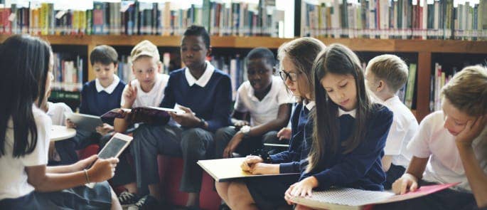 Primary school children discuss heated topics in the school library