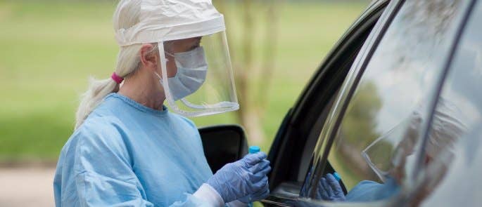 Healthcare worker delivering medicine