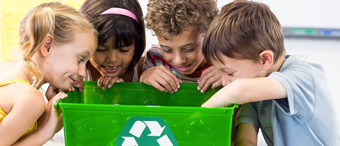 School children working together to recycle