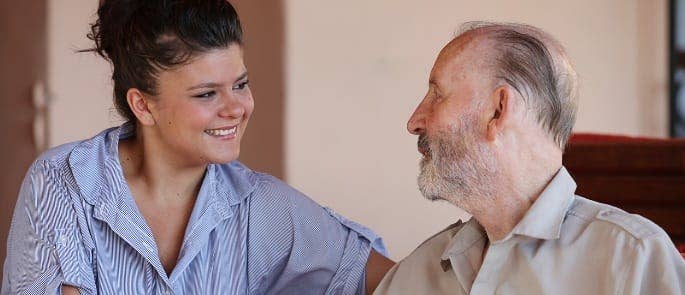 A nurse assessing the needs of a vulnerable adult and providing appropriate care