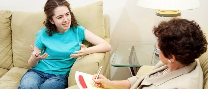 Social worker talking to young woman