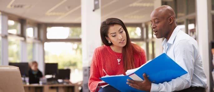 Student and teacher discussing work experience placement