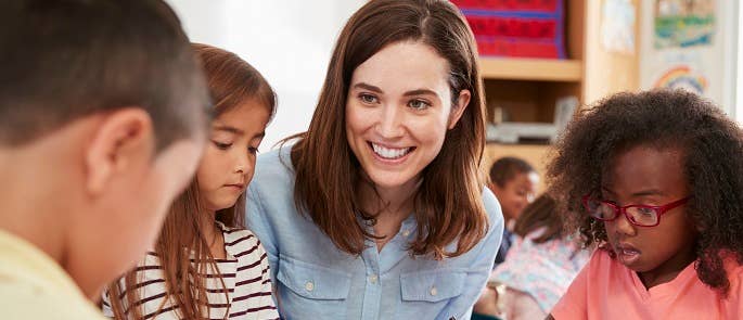 Teacher talking to pupils