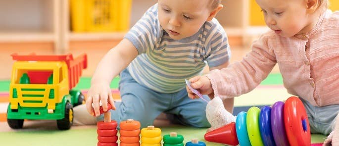 Two children playing in nursery