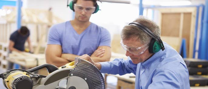 Two men at a college construction skills training session