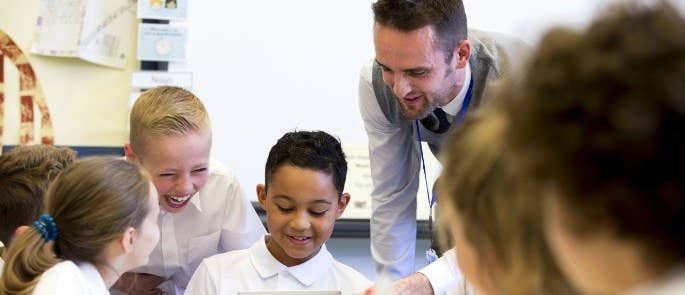 Students using a tablet in the classroom