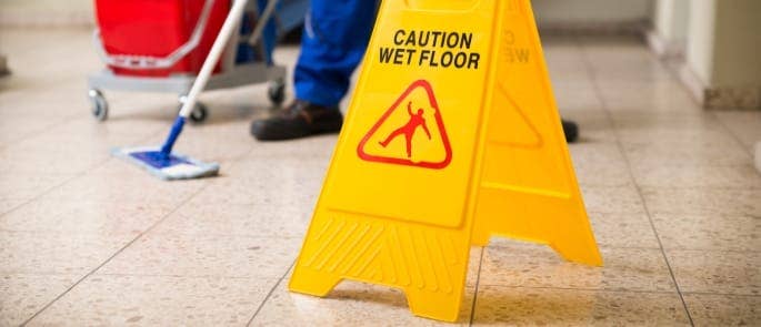 preventing slips trips and falls with a wet floor sign sign