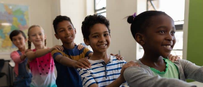 Children playing in school corridor