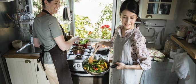 Women cooking vegetables