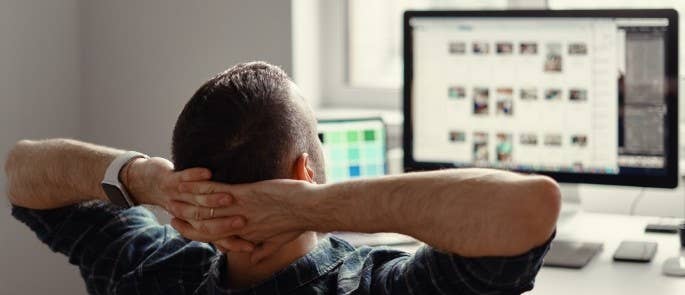 Worker relaxing at home office desk