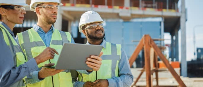 Workers on construction site planning