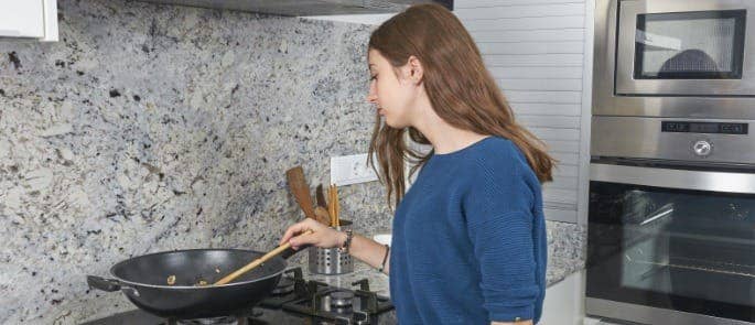 young carer cooking