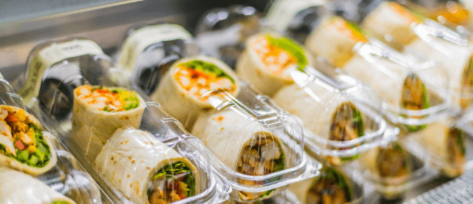 Sandwich wraps in plastic packaging in a deli counter